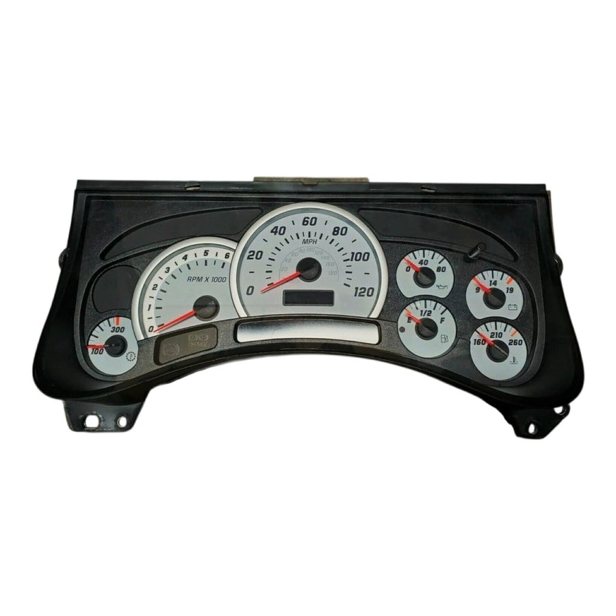 2003–2006 Hummer H2 instrument cluster with white gauge faces showing speedometer, tachometer, and auxiliary gauges.
