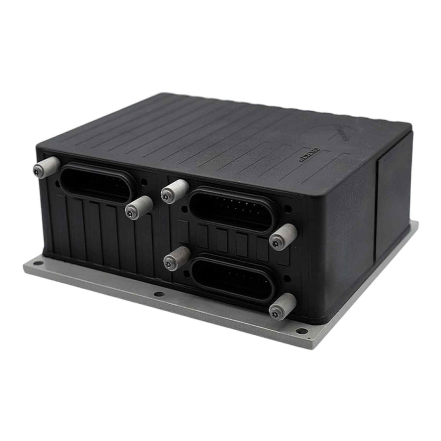 Heavy-duty semi-truck engine control module (ECM) on bench showing three main connectors and mounting plate, used for ECM testing, cloning, and repair services. Cummins Celect n14 ecm