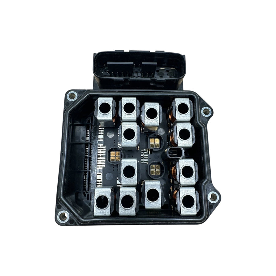 Internal view of Honda ABS module showing solenoid valves and hydraulic channels